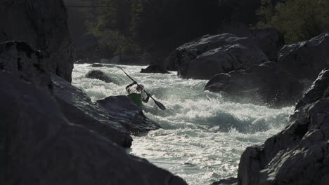 kayaker navigating a whitewater rapid