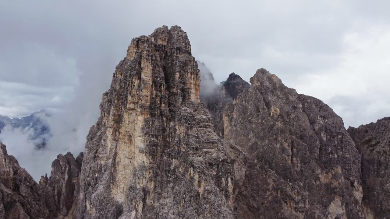 Epic orbit drone shot of Cadini di Misurina in Dolomites, Italy