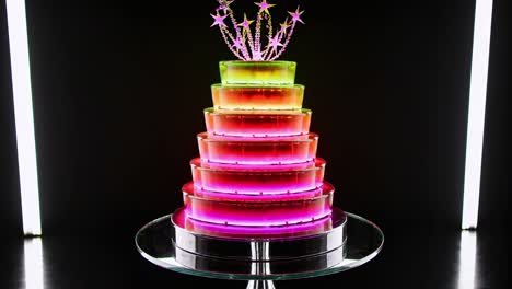 luminous neon cake pulsating with vibrant color gradients, spinning on a sleek rotating platform against deep black backdrop, illuminated by crisp white neon lighting