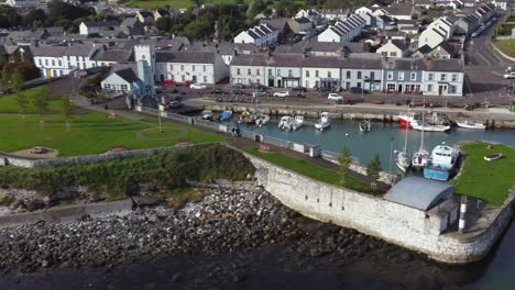 aerial view of carnlough harbour and town on a sunny day, county antrim, northern ireland