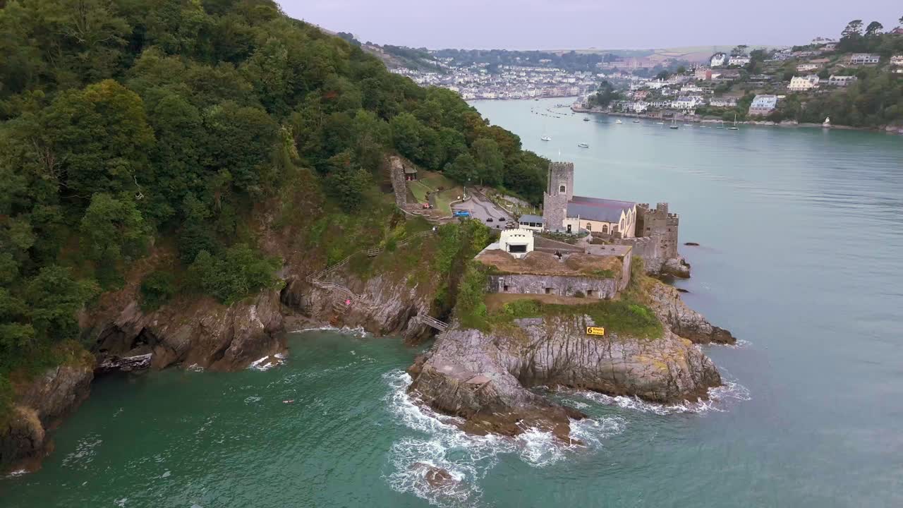 Daytime, aerial reverse over Dartmouth Castle out to sea with Estuary in background