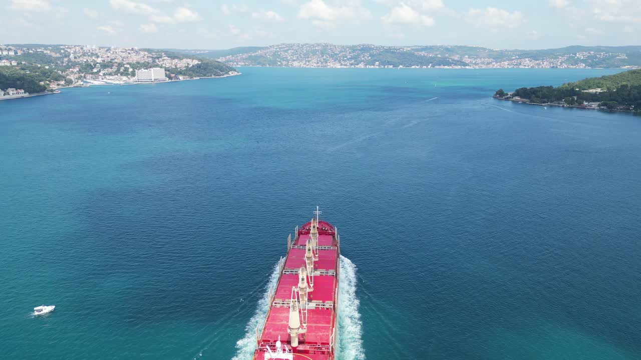 Aerial view a cargo ship through calm waters of Bosporus Sea