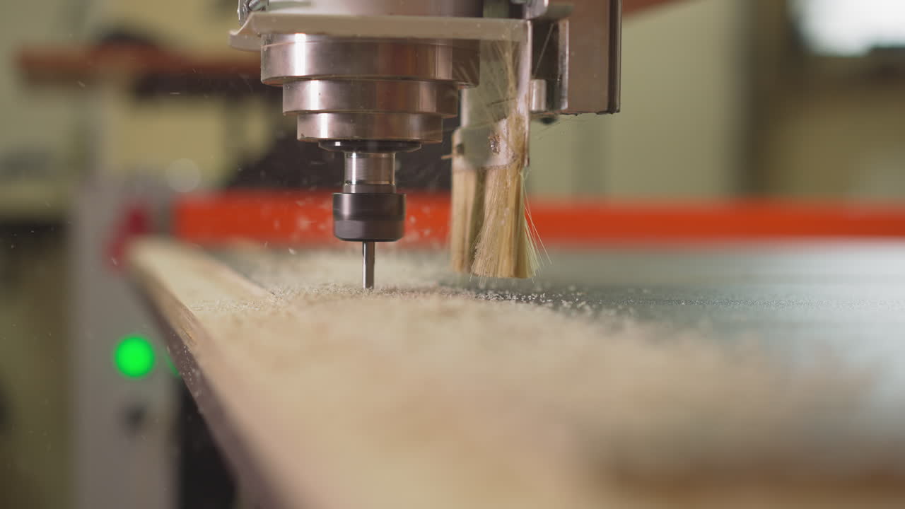 Modern wooden material cutter operates with plywood in shop