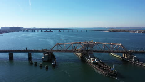 An-aerial-shot-over-a-swing-bridge-in-Queens,-NY