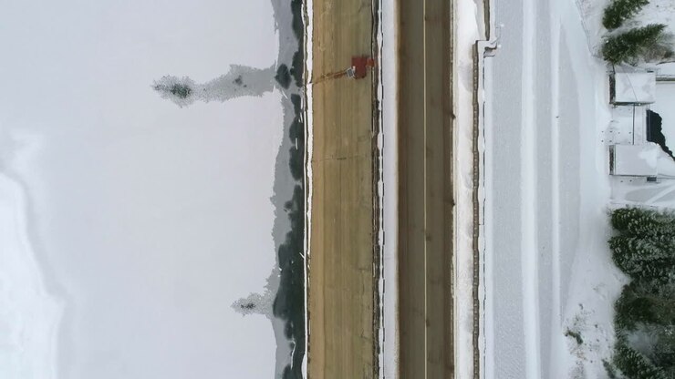 dam wall in winter , aerial drone