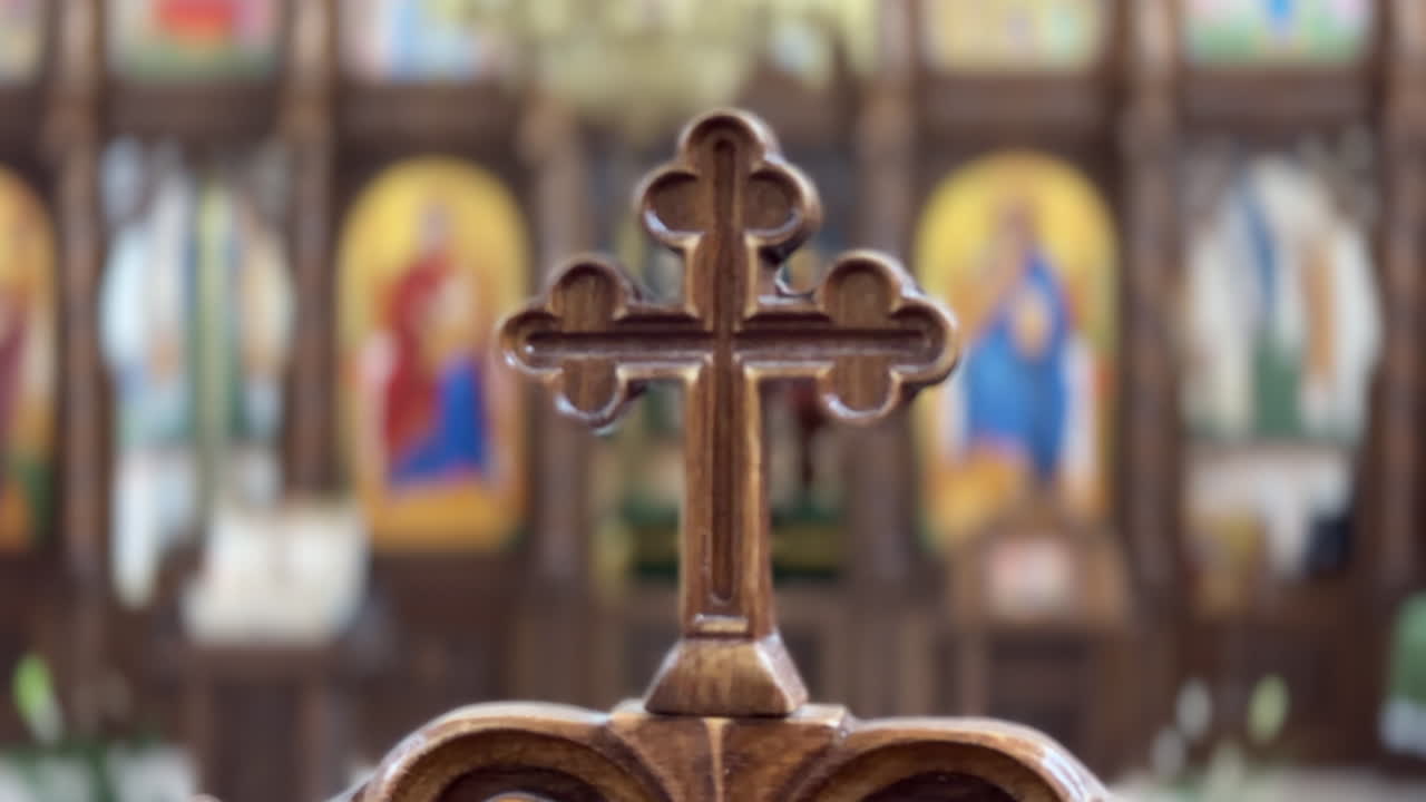 Interior details of the Merry Cemetery Church in Sapanta, Romania, highlighting its iconostasis and cross
