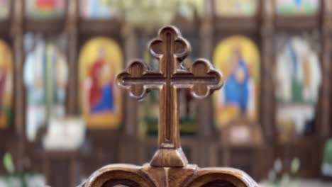 interior details of the merry cemetery church in sapanta, romania, highlighting its iconostasis and cross