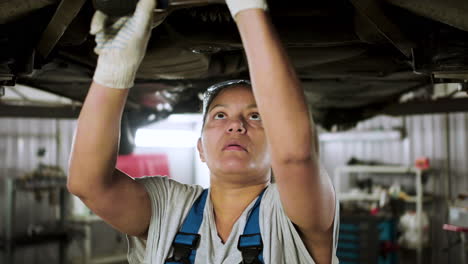 woman repairing car