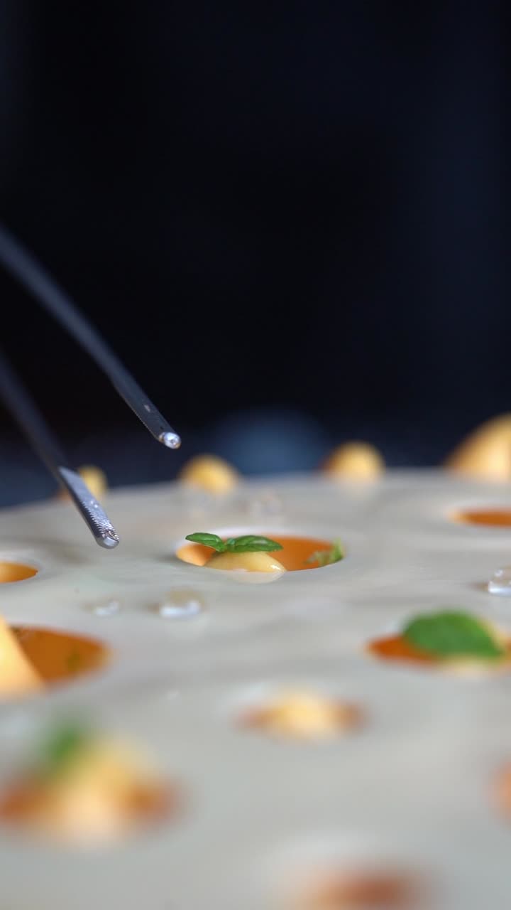 A chief decorated a creamy gateau with a mint paper, close up shot, insert shot