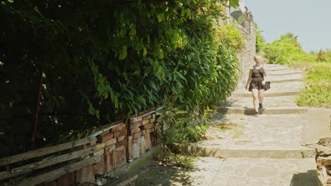 Female-travel-tourist-explorers-historic-Veliko-Tarnovo-on-hot-sunny-day