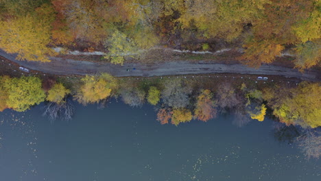 runnres runing in the autumn lake