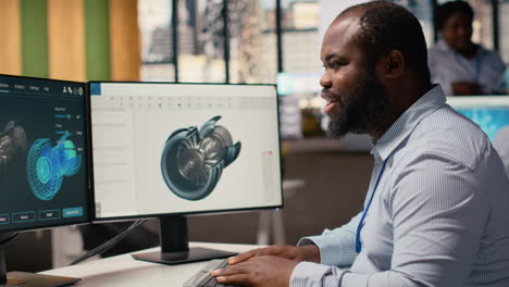 engineer in office working on wind turbine cad design for improved technology