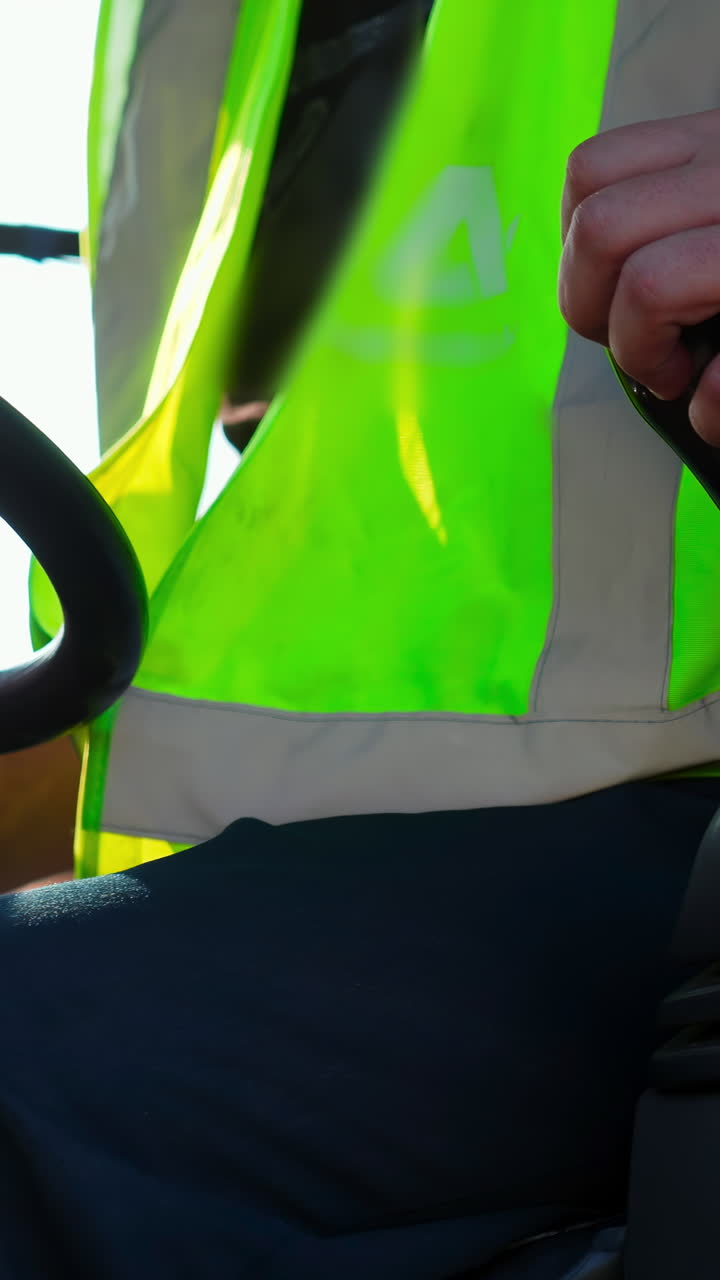 Close-up of a hand operating a joystick