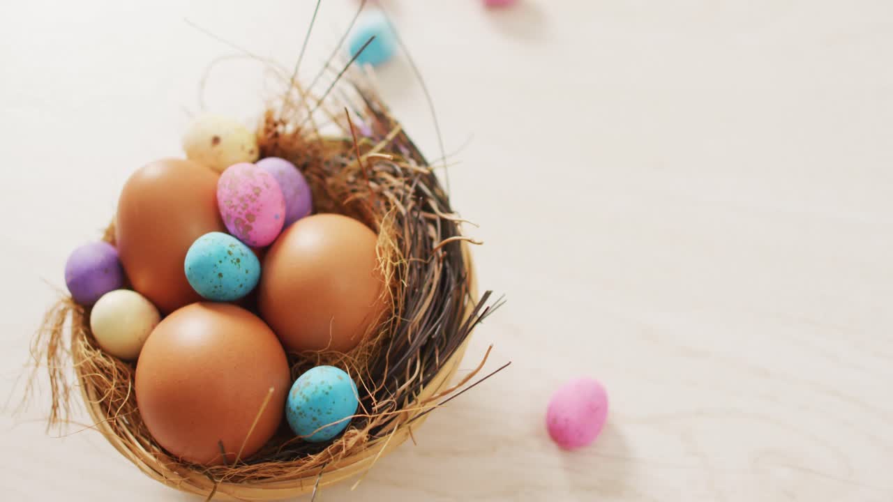 Video of decorated colorful easter eggs on a wooden surface