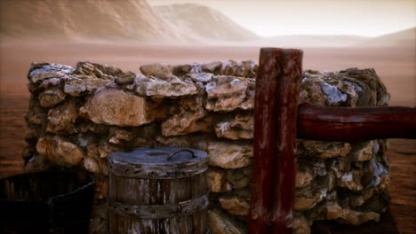 old stone water well in the desert