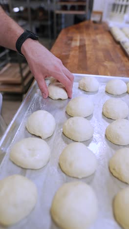 baker preparing dough balls