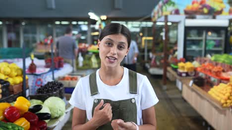 woman speaking at a farmers market