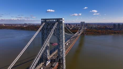 an aerial view of the george washington bridge from over fort lee, new jersey on a sunny day in autumn