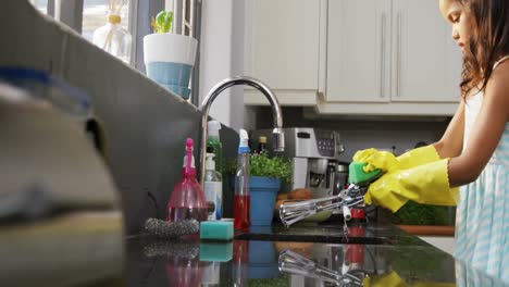 girl washing utensils in the kitchen 4k 4k