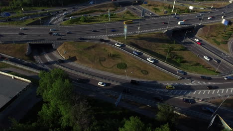 Car-driving-on-roundabout-road.-Aerial-view-car-traffic-on-highway-junction