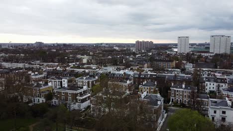 Aerial-pan-shot-showing-District-Of-Notting-Hill-In-London-with-high-rise-blocks-in-background