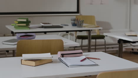 classroom scene with desks and learning materials