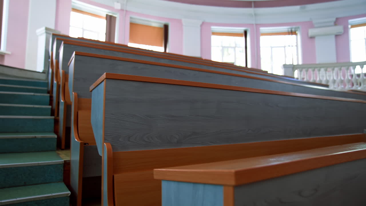 Empty seats in university classroom. Empty lecture hall with large amount of seats