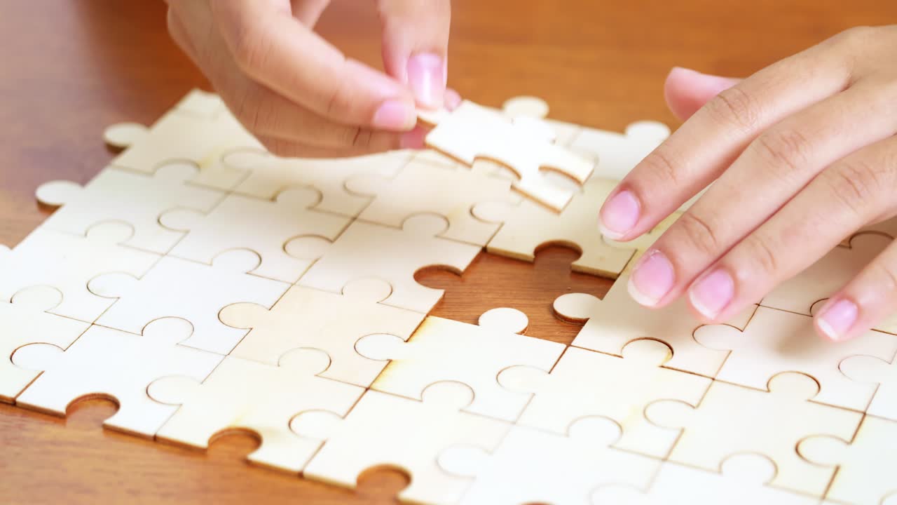 A close-up of a nearly completed jigsaw puzzle illustrating the joy of problem-solving