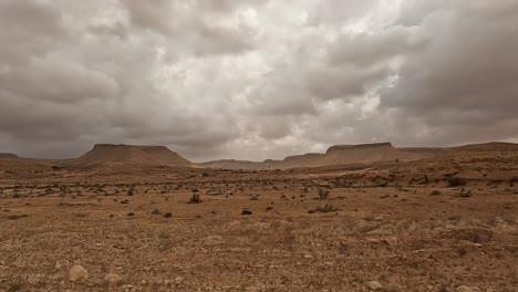 rainy weather over tunisia desert road, car driver pov