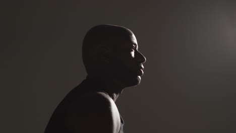 Close-Up-Side-View-Studio-Shot-Of-Male-Basketball-Player-Shooting-Ball-At-Basket-1