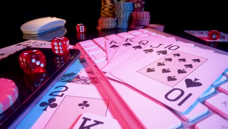 gambling table with playing cards, dice, and chips
