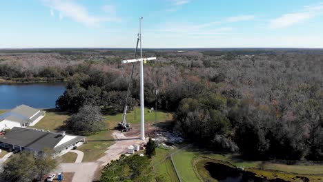cross-shaped cell phone tower on church property
