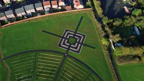 modern target cemetery pathway pattern aerial view artistic garden of rest descending rotation