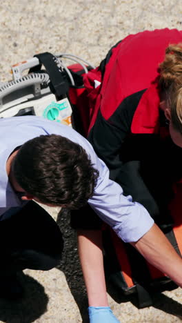 paramedics examining injured girl