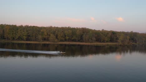 sunset over the river with boat