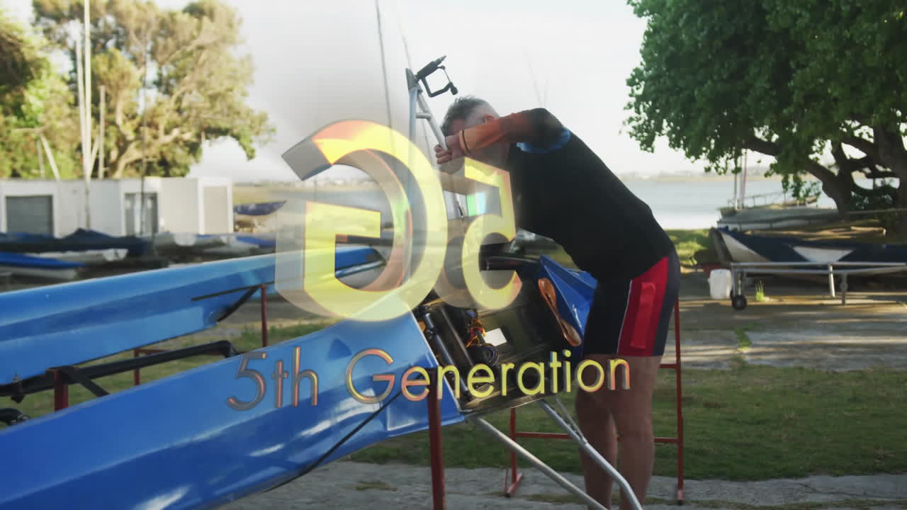 Senior male rower adjusting footplate in boatyard showing animated rowing gear icons