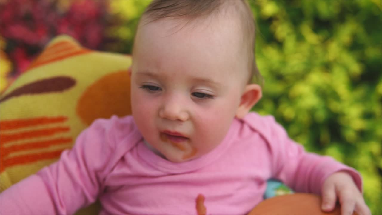 Baby Eating in a High Chair
