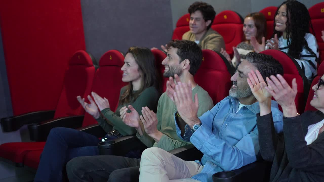 Audience Applauding in a Movie Theater