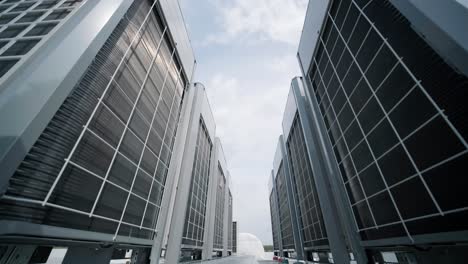 the air conditioning and ventilation system of a large industrial facility is located on the roof. it includes an air conditioner, smoke exhaust, and ventilation.