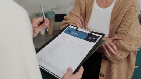 woman signing invoice