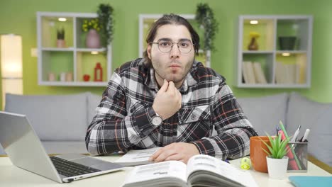 Listening to the good news, the male student approves.