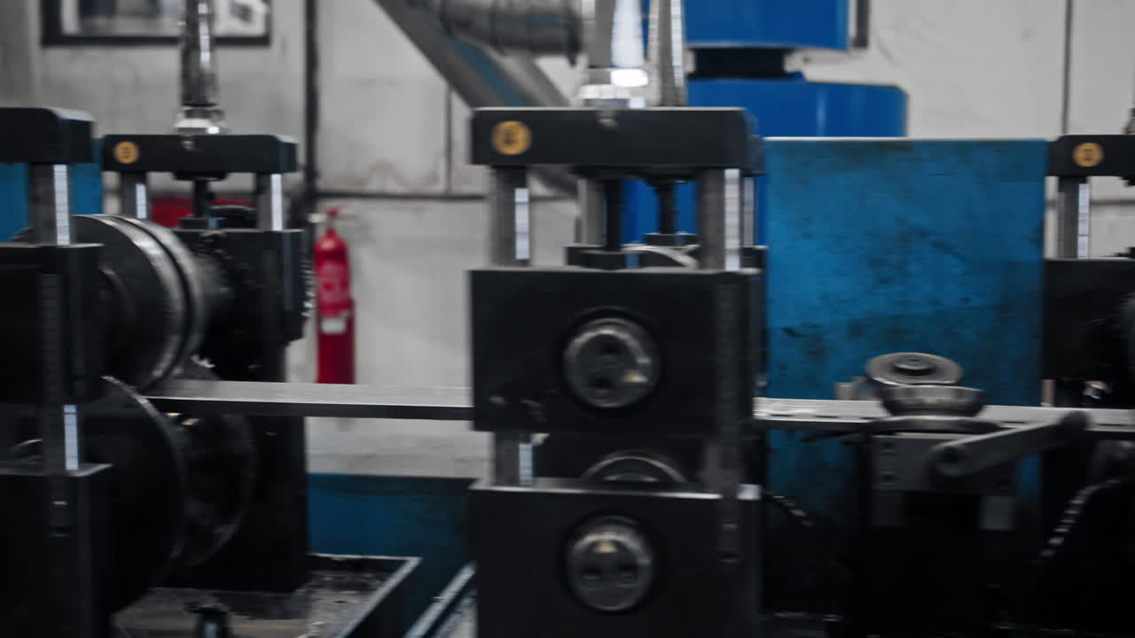 Close up of a long metal sheet processing machine