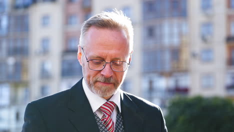 portrait of fashionable senior man. portrait of fashionable well dressed man with beard posing outdoors