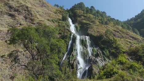 Close-up-Drone-shot-of-Narchyang-waterfall-in-Annapurna-region-Nepal,-Cinematic-landscape-is-captured-in-sunny-weather-with-peaceful-vibes-4K