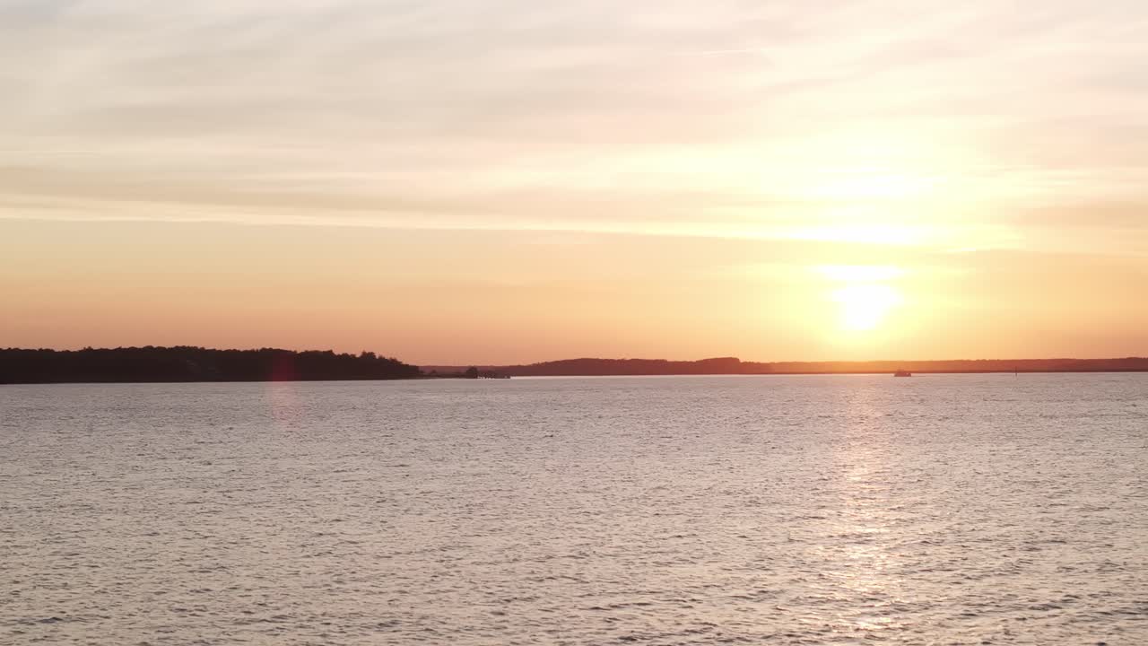 Peaceful dusk at harbor with soft light on water, showing stillness and quiet surroundings
