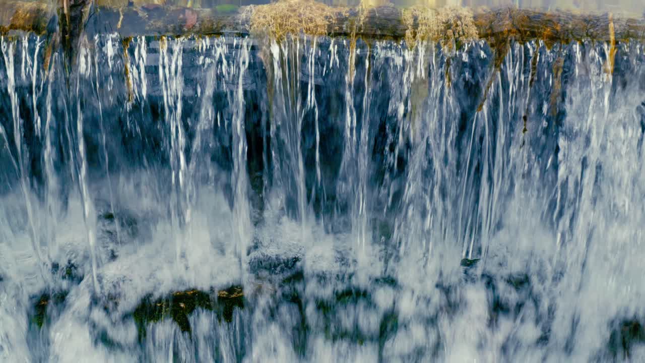Immerse yourself in the pristine beauty of the Julian Alps with this stunning capture of a mountain river near Kranjska Gora, Slovenia. Crystal-clear turquoise water flows over smooth river rocks.