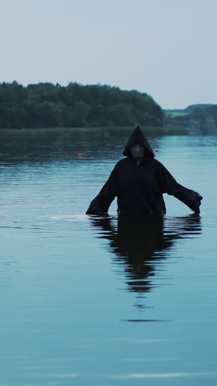 Evil ghost in the water. Halloween costume. Vertical video