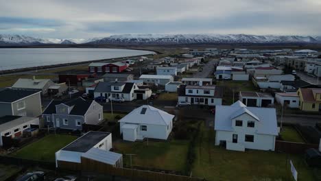 drone shot of small town in iceland during winter in the morning