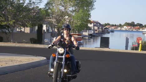 woman motorcyclist with dog