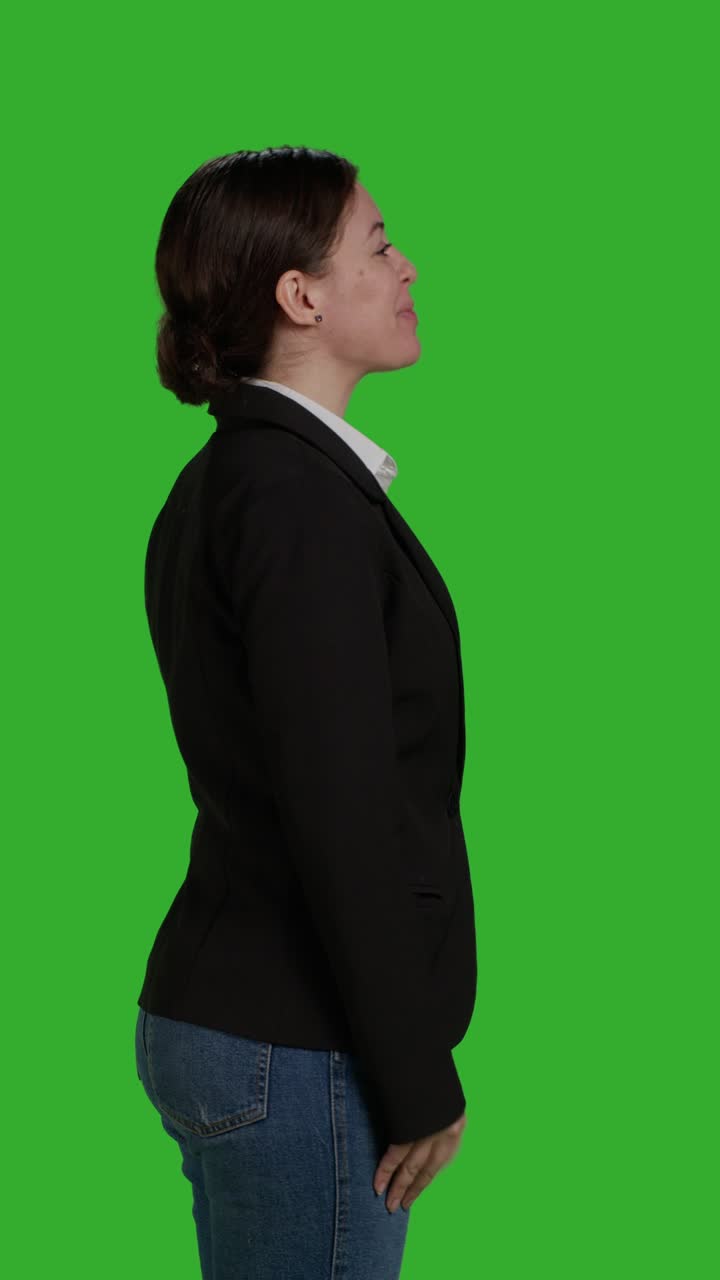 Vertical video: Profile close up of female manager wearing office suit